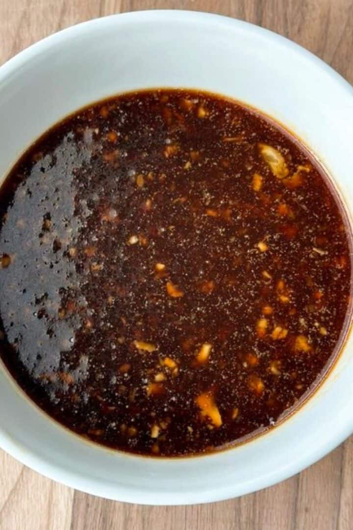 White bowl full of honey soy marinade