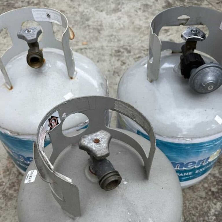 Three propane tanks sitting on a patio