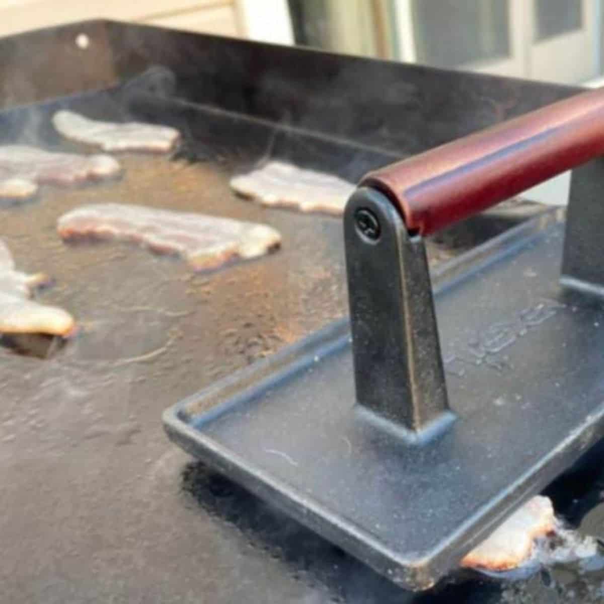 Bacon cooking on a Blackstone griddle