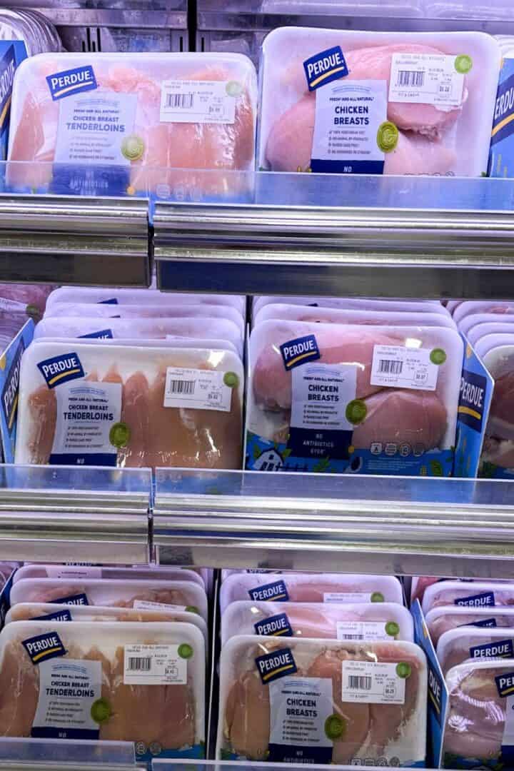 Different cuts of chicken breast on a supermarket shelf