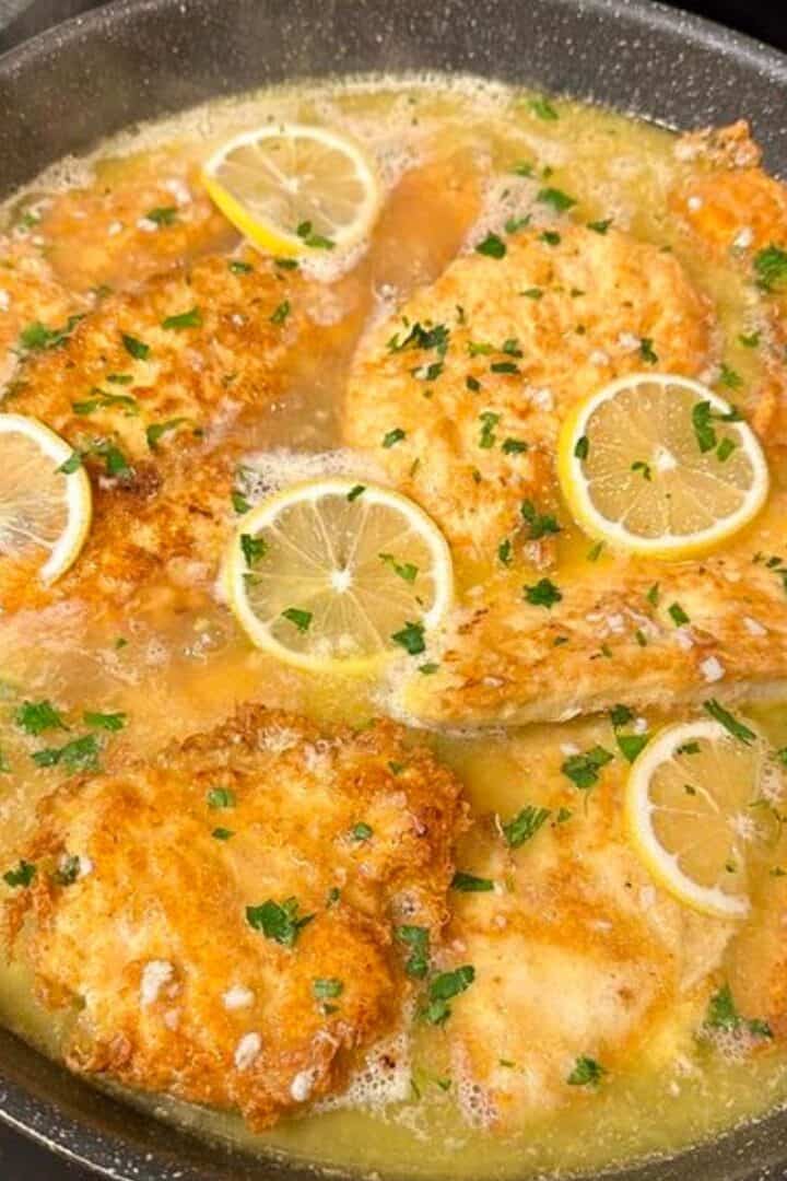 Skillet of chicken francese on the stove