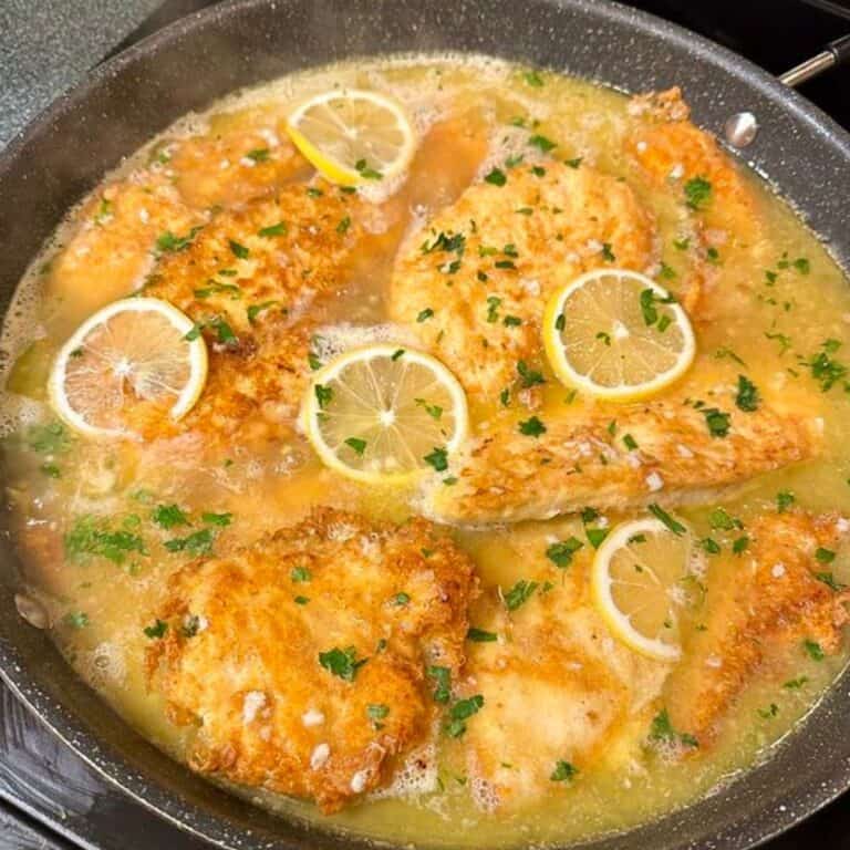 Skillet of chicken francese on the stove