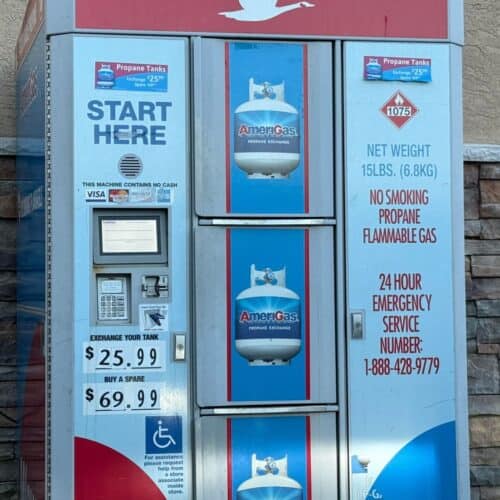 An automated propane exchange station showing a price of $25.99