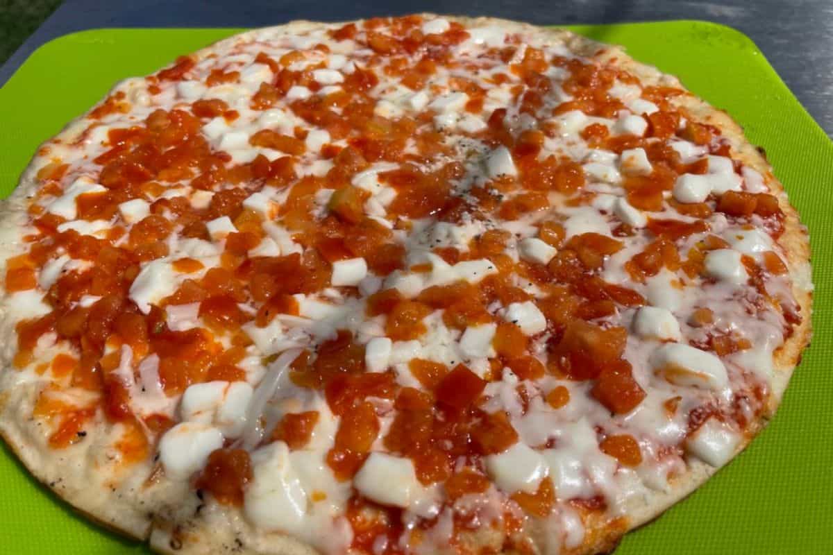 Frozen pizza margherita that was cooked on a blackstone griddle