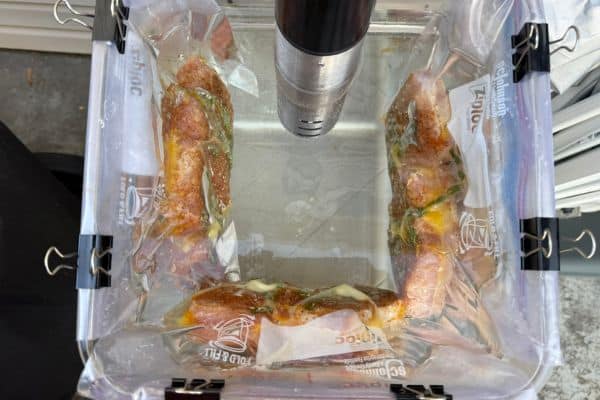Sous vide pork chops cooking in a water bath