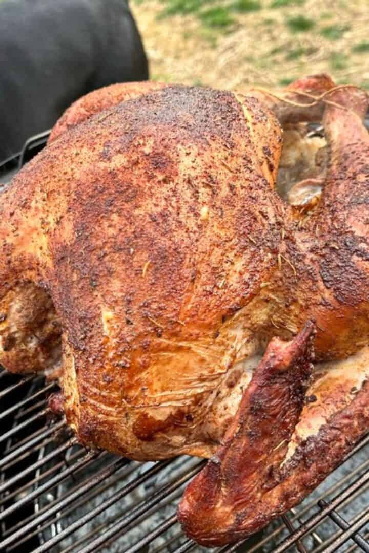 Turkey smoking on a charcoal smoker