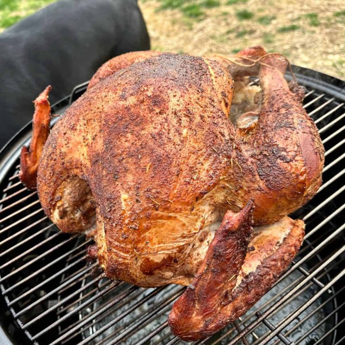 Turkey smoking on a charcoal smoker