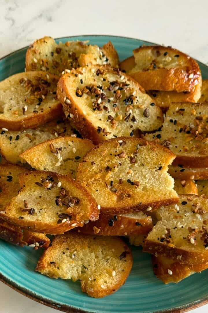 Blue plate full of homemade everything bagel chips