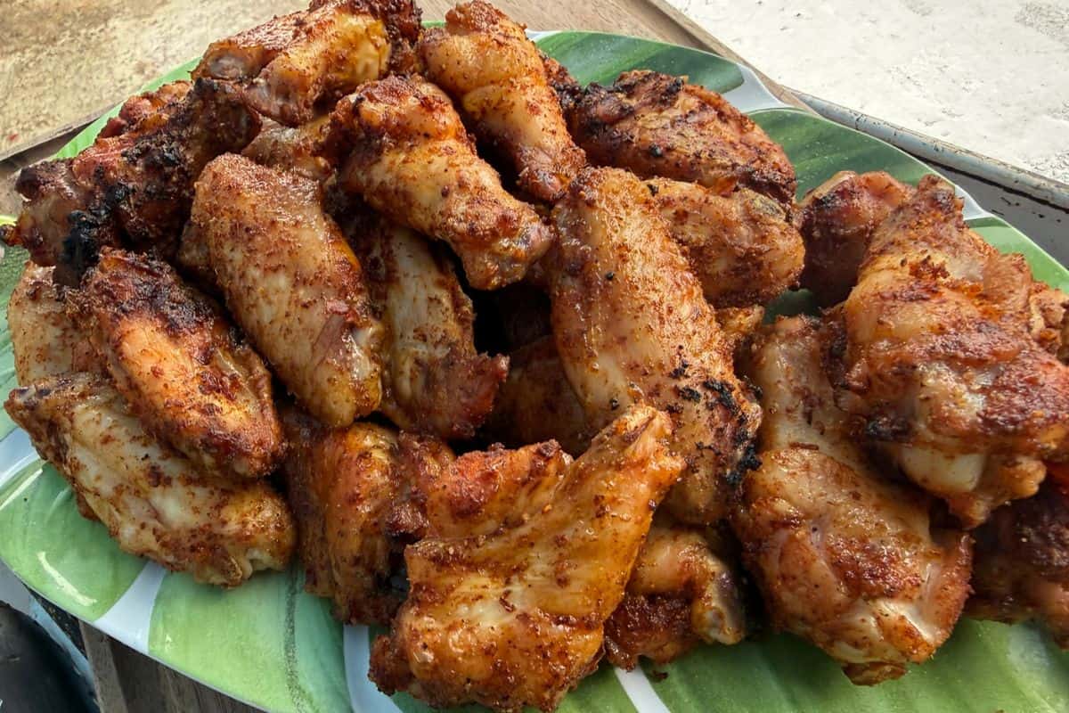 A plate of crispy smoked chicken wings