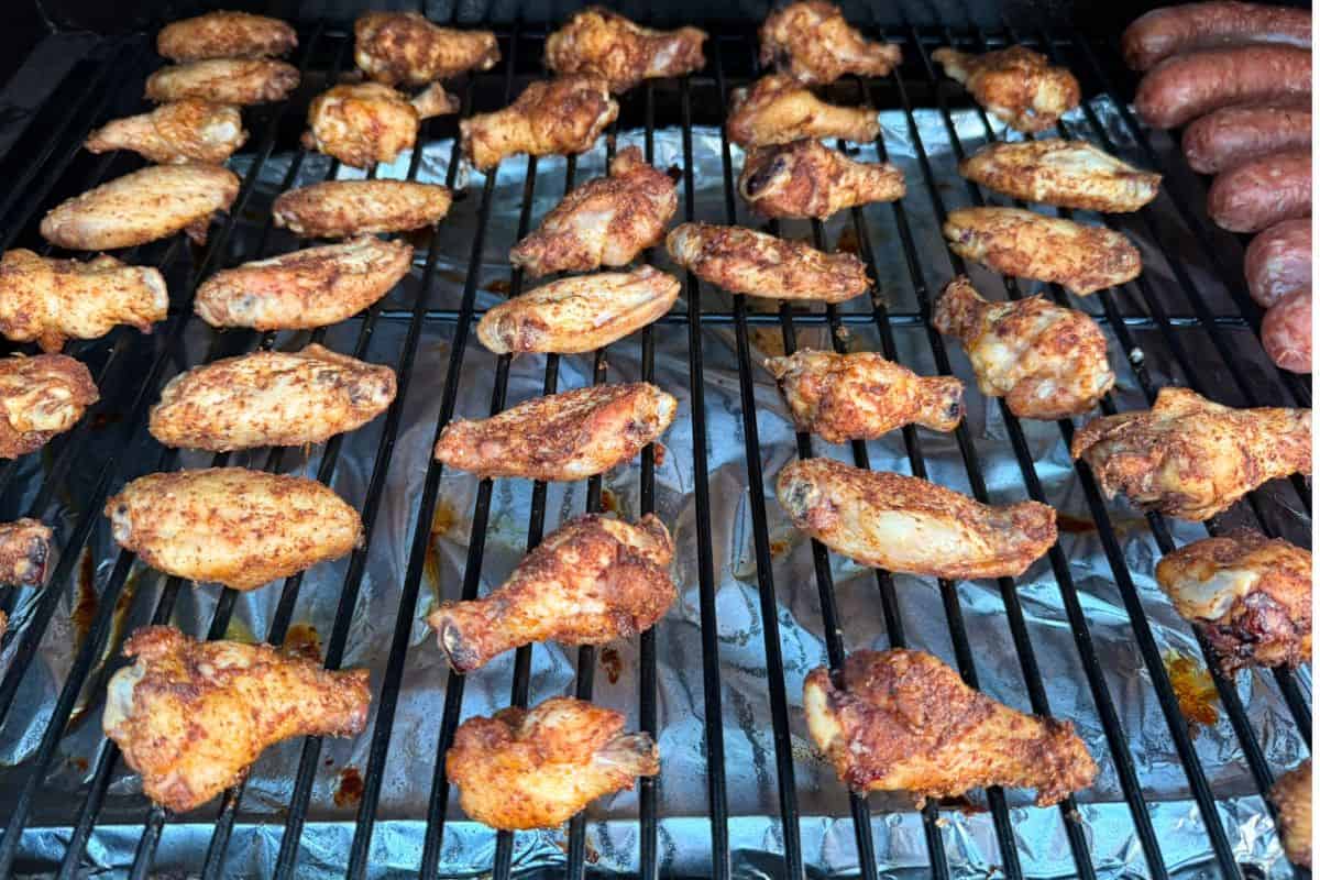 Chicken wings crisping up on a grill
