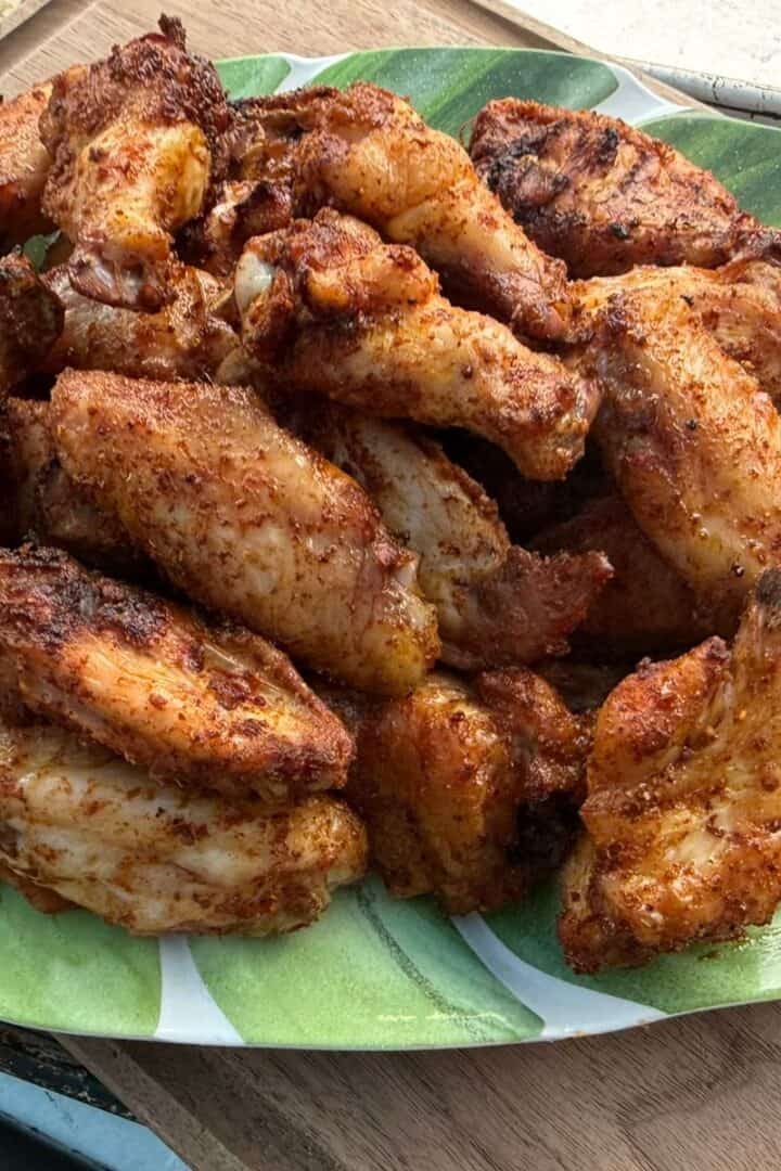 A plate of crispy smoked chicken wings