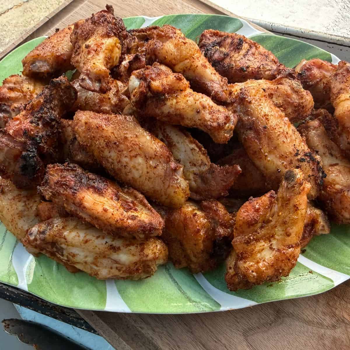 A plate of crispy smoked chicken wings