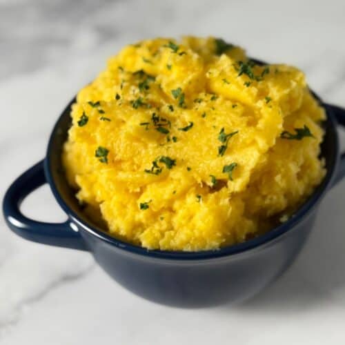 Blue bowl full of mashed rutagaba