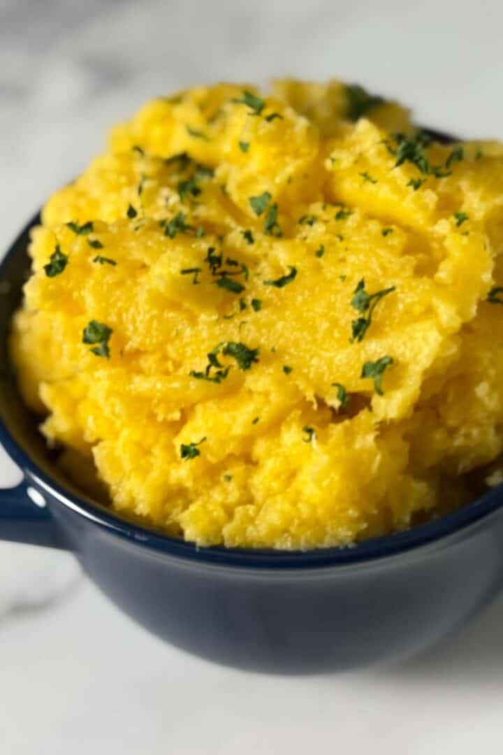 Blue bowl full of mashed rutagaba
