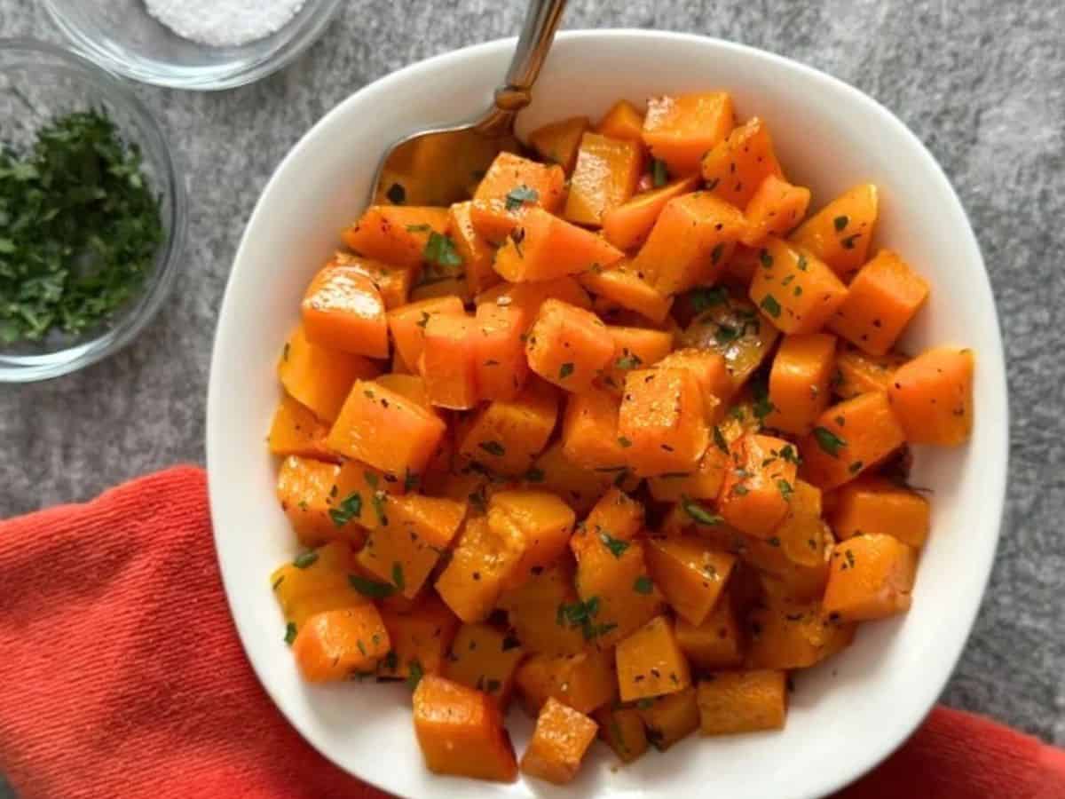 White bowl full of roasted butternut squash